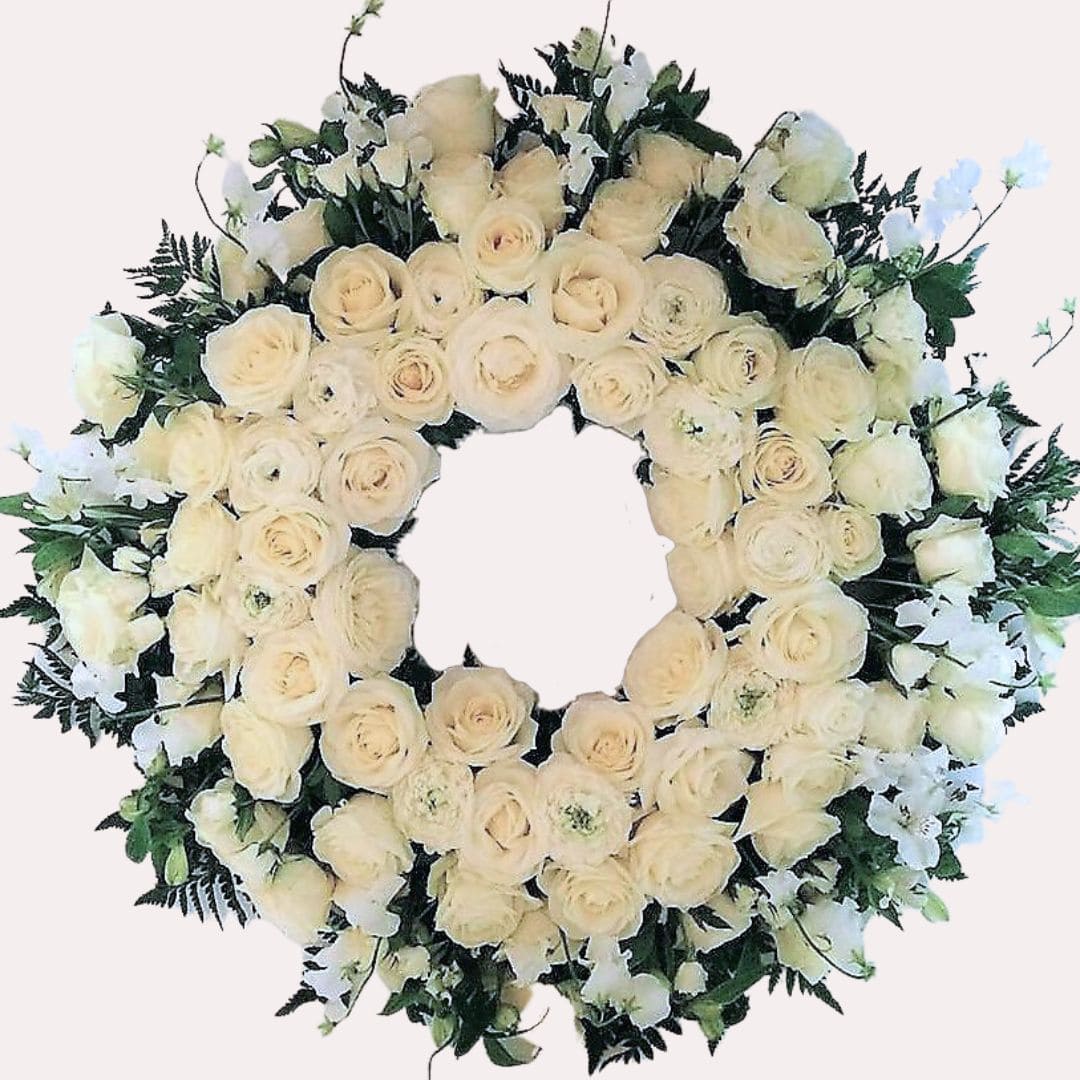 hvid blomsterkrans til begravelse